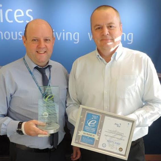 David Baptie, Senior Building Surveyor (Planned), Dunedin Canmore and George Donaldson, Managing Director, Insulation Solutions Scotland, celebrate with their award