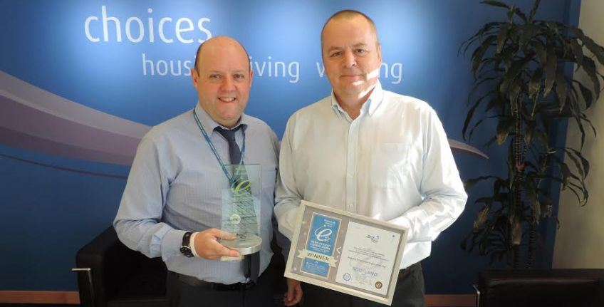 David Baptie, Senior Building Surveyor (Planned), Dunedin Canmore and George Donaldson, Managing Director, Insulation Solutions Scotland, celebrate with their award