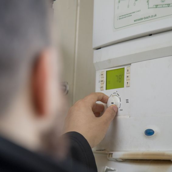 Man fixing boiler 